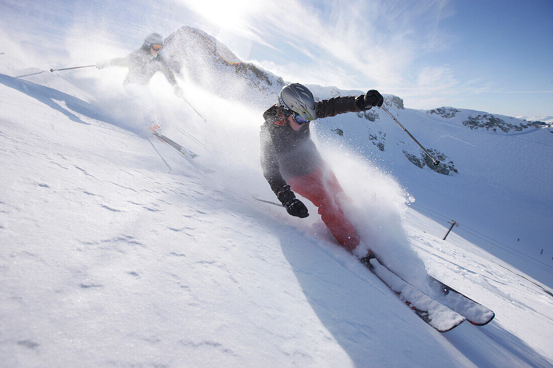 Skiers downhill skiing at Blackcomb Peak, British Columbia, Canada