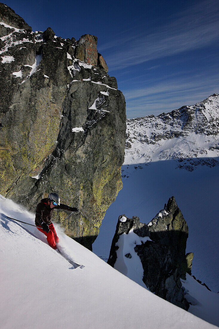 Skier downhill skiing at Blackcomb Peak, British Columbia, Canada