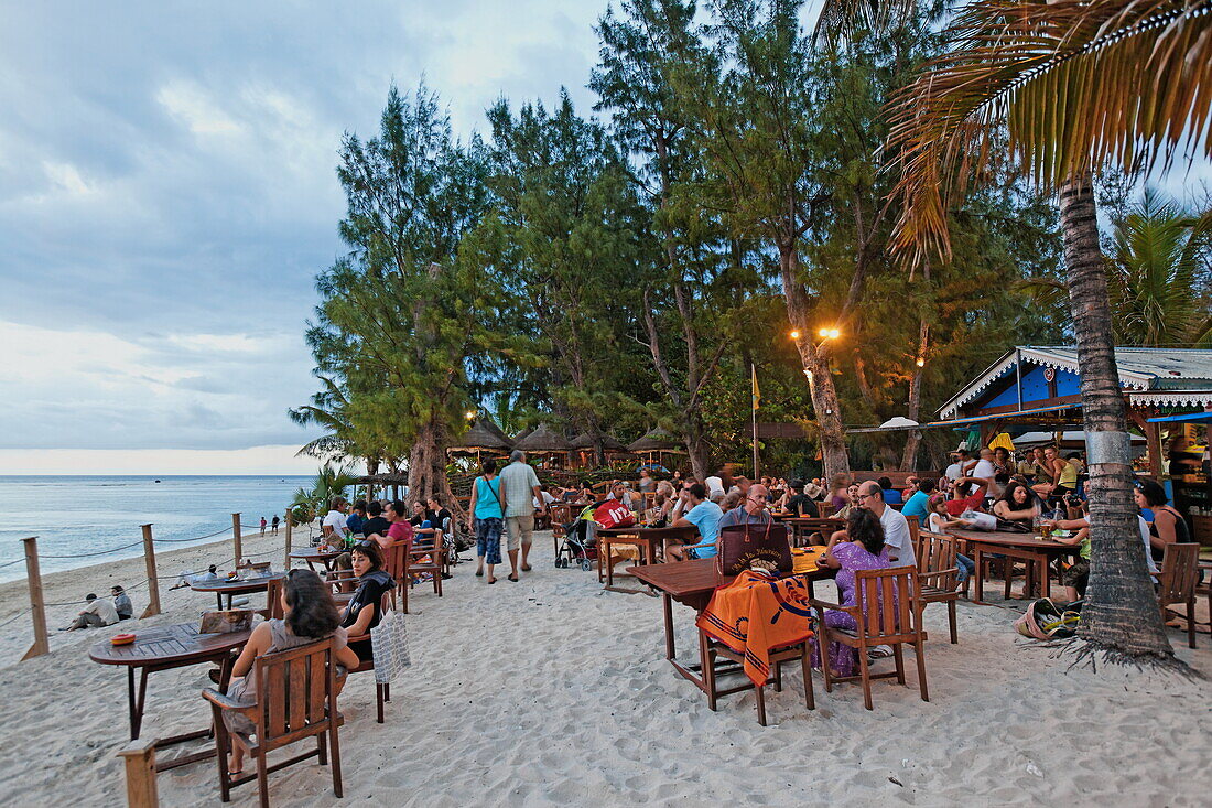 People in one of Saint Gilles beach bars in the evening, La Reunion, Indian Ocean