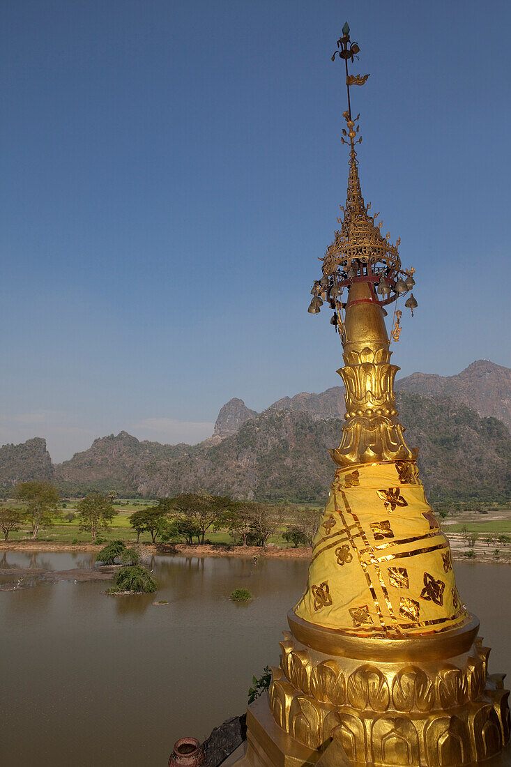 View from the Kyauk Ka Lat Pagoda on a rock, golden stupa in front of karst mountains, Kayin State, Myanmar, Birma, Asia