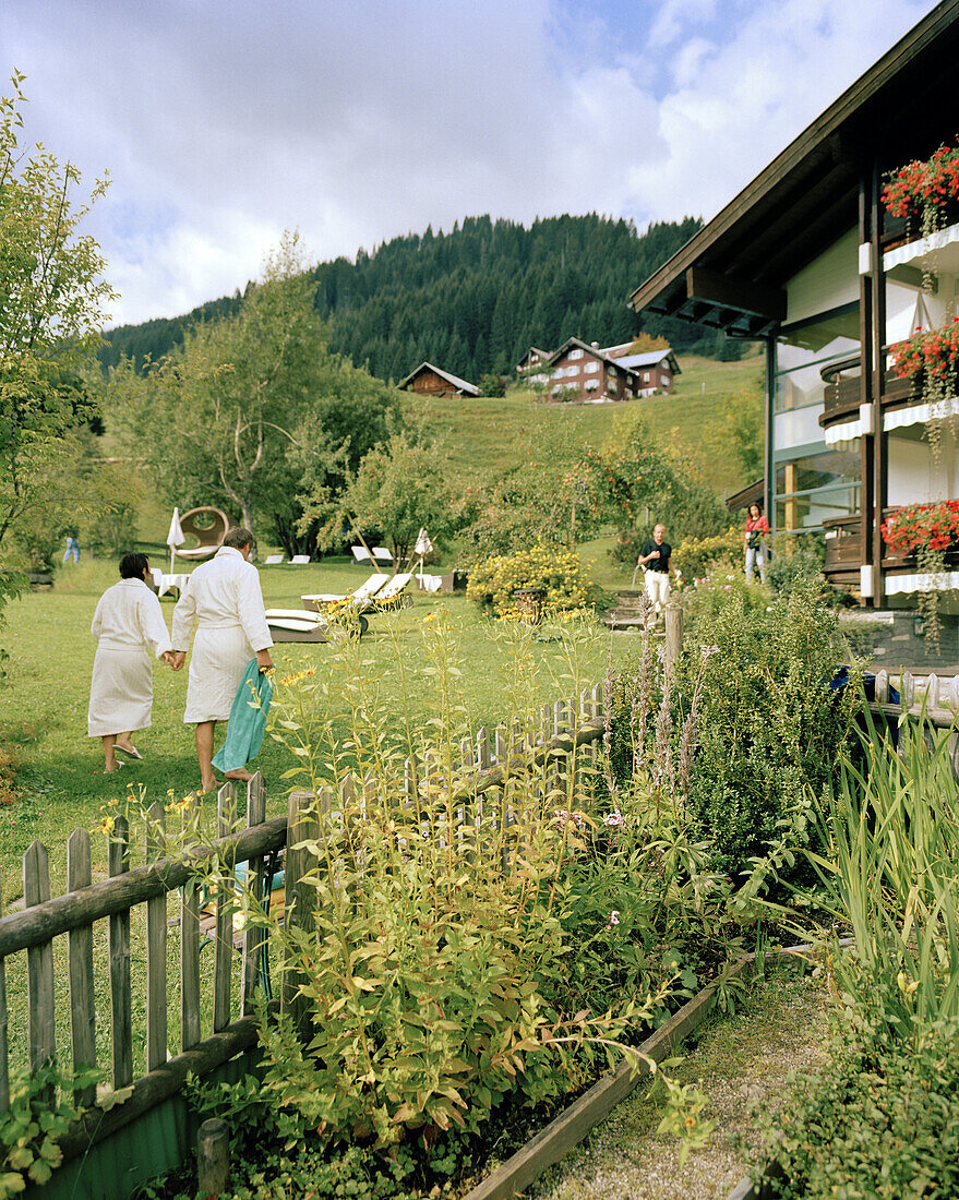 People relaxing in the garden, organic Hotel Chesa Valisa, Hirschegg, Kleinwalsertal, Austria
