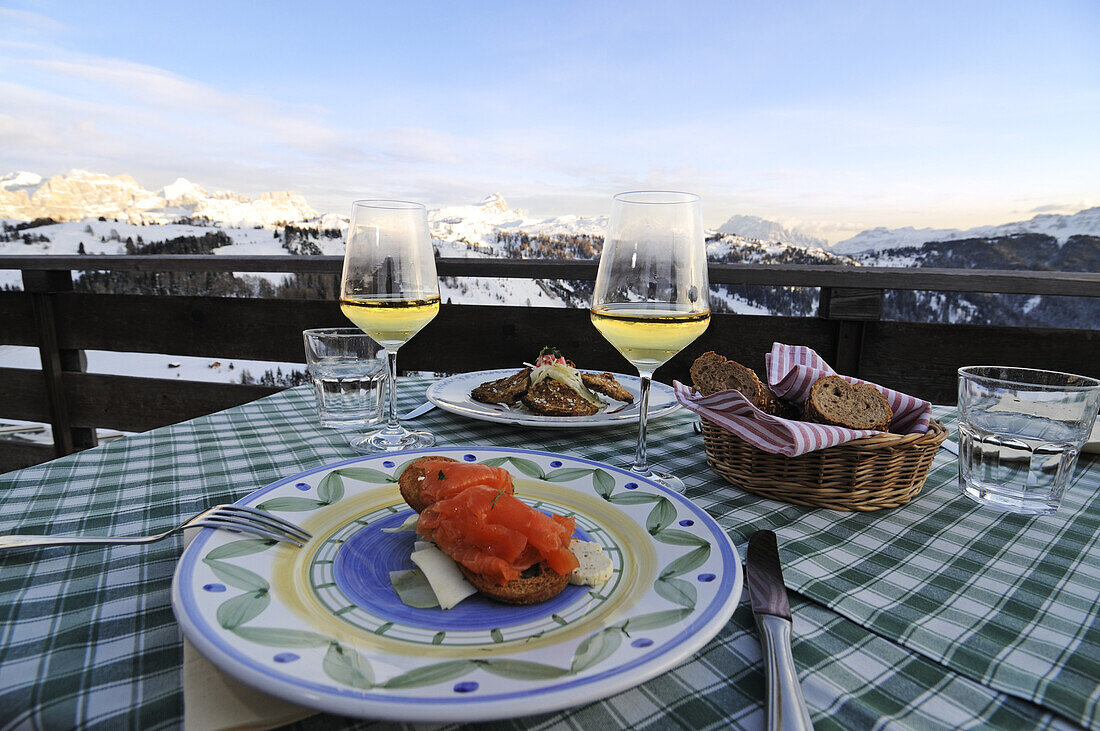 A table is laid on a balcony in front of Sella group, Hotel Col Alt, Alta Badia, South Tyrol, Italy, Europe