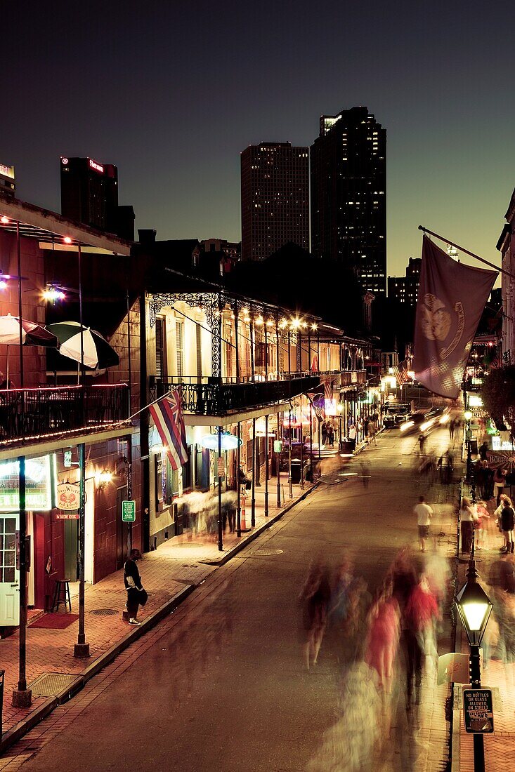 USA, Louisiana, New Orleans, French Quarter, Bourbon Street and city skyline, elevated view, dusk