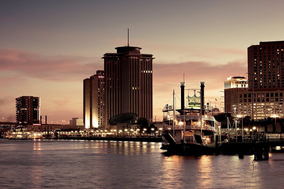 USA, Louisiana, New Orleans, World Trade Center, riverboat and Mississippi Riverfront, dusk