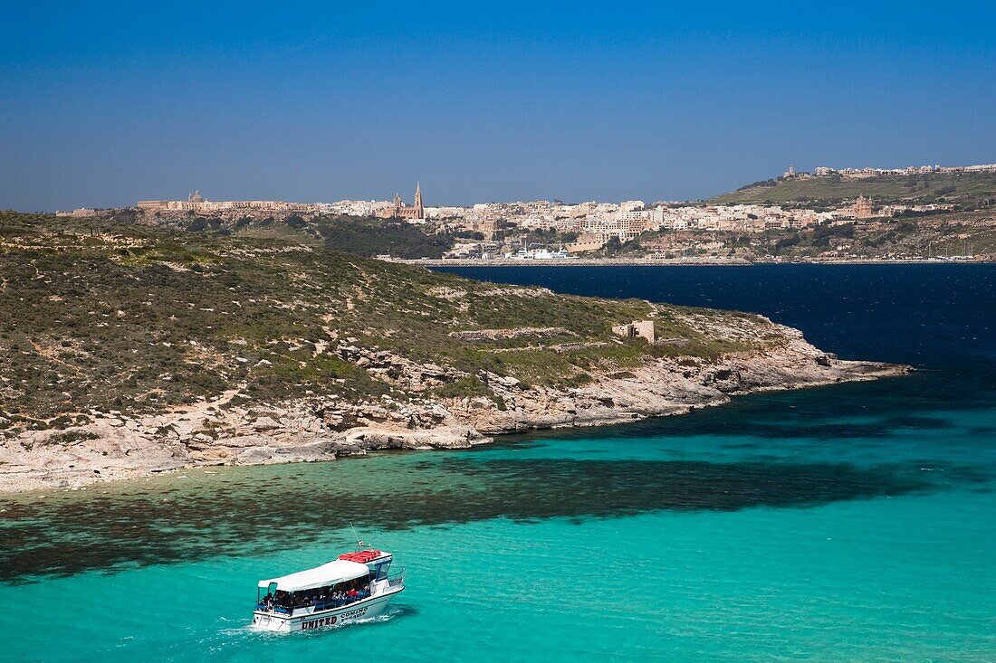 Malta, Comino Island, The Blue Lagoon with tour boat