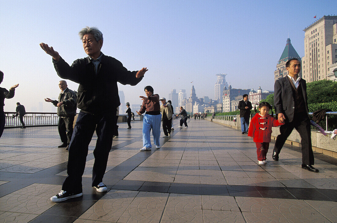 Early morning tai chi exercises on the Bund, Shanghai, China