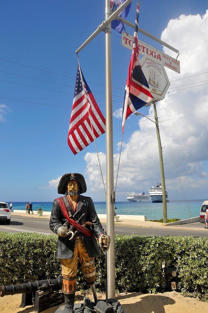 Pirate statue with flags at Tortuga Rum Cake Ship Grand Cayman Islands Caribbean Georgetown