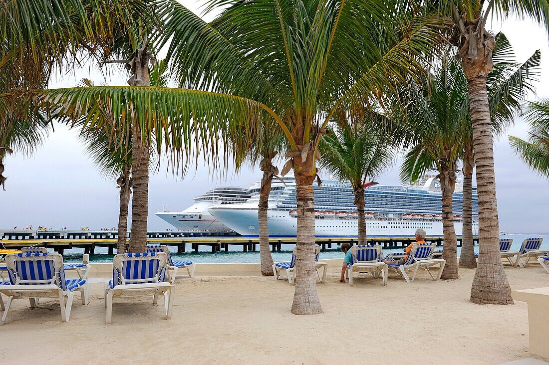 Blue lounge chairs near Caribbean Cruise Ship in Puerta Maya and Cozumel Mexico