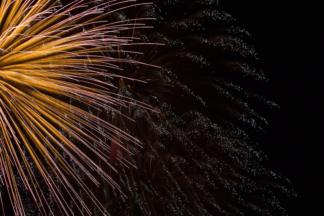 Gold, Red and White Fireworks display in the Night Sky, Terrebonne, Quebec, Canada