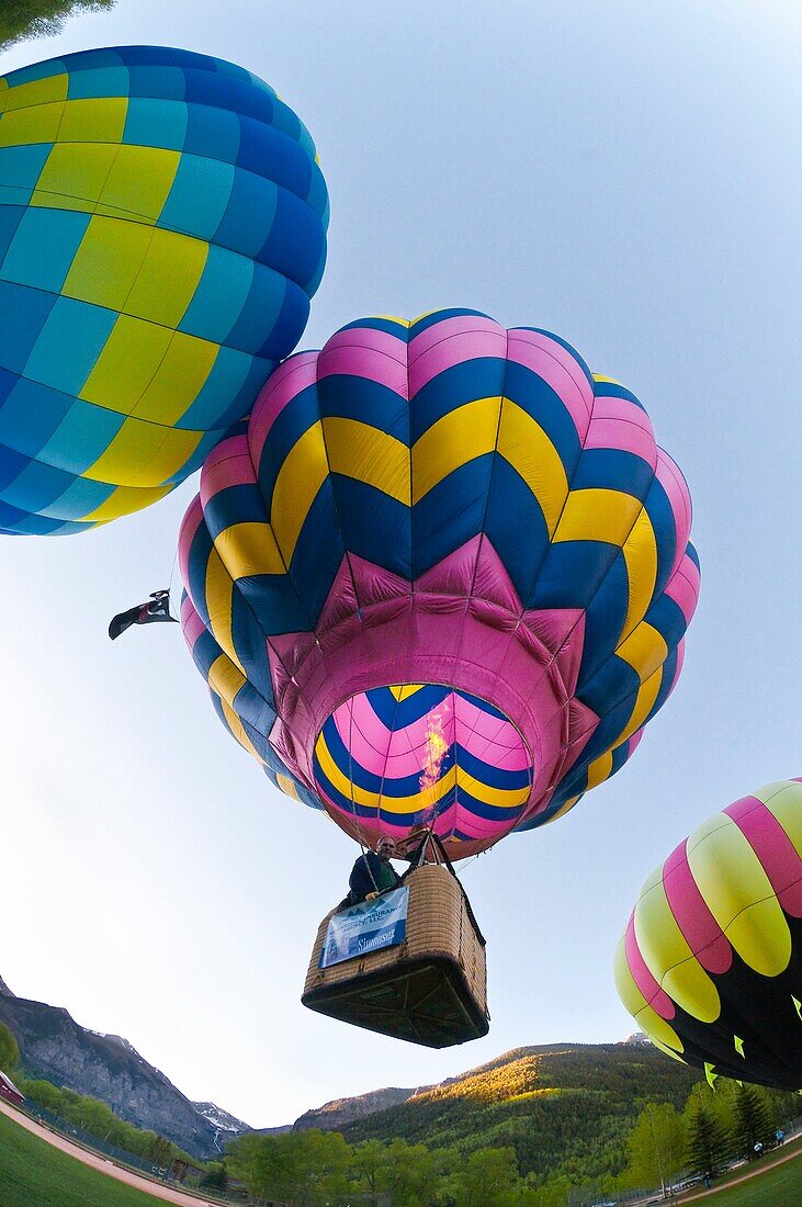 Hot air balloons flying above Telluride during the Telluride Balloon Festival, Telluride, Colorado USA