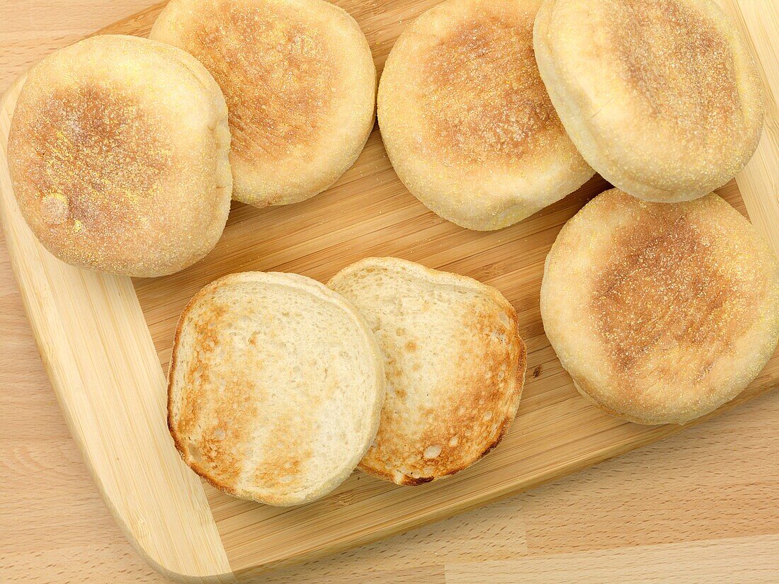 English muffins isolated on a wooden kitchen bench