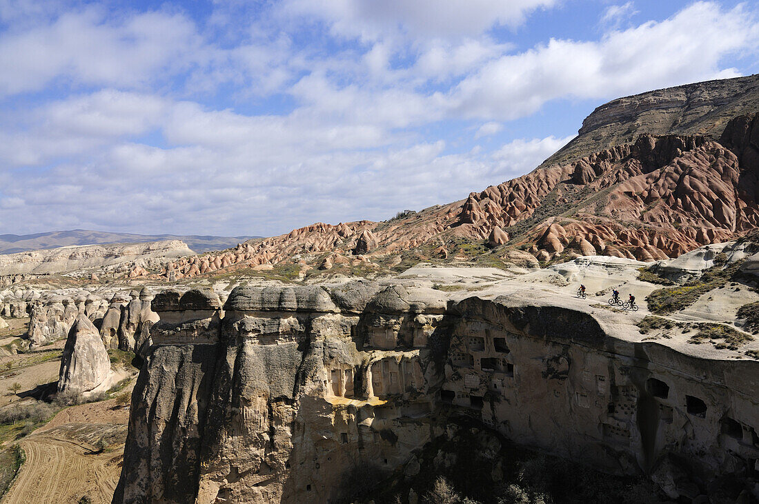 Mountain bikers near Cavusim, Göreme valley, Göreme, Cappadocia, Turkey