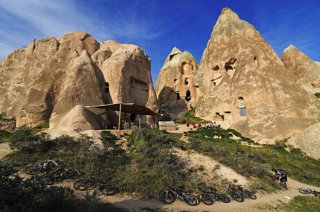 Mountain biker in the Güvercinlik valley, Göreme valley, Göreme, Cappadocia, Turkey