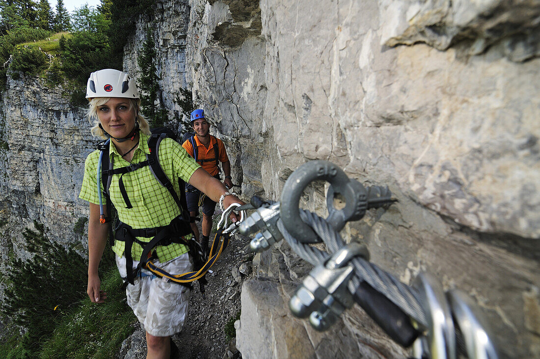 Couple climbing at Gamssteig fixed rope route, Steinplatte, Reit im Winkl, Chiemgau, Upper Bavaria, Bavaria, Germany, Europe