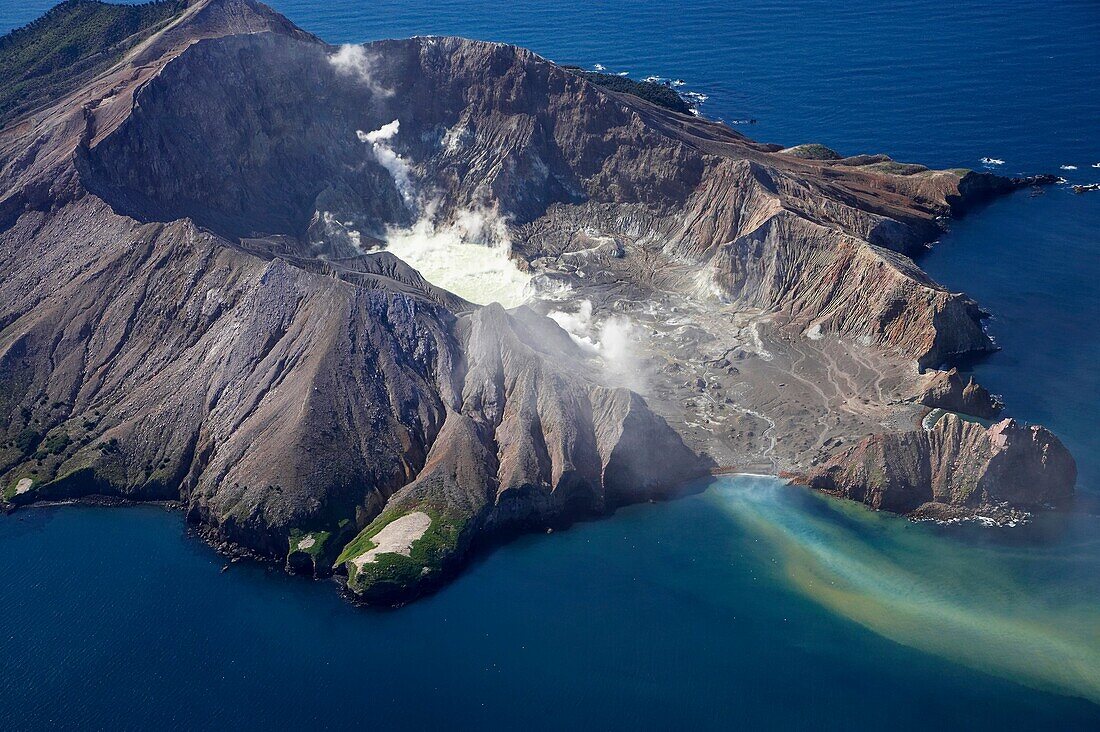 Aerial view of the steaming crater lake and outflow of the active volcano White Island