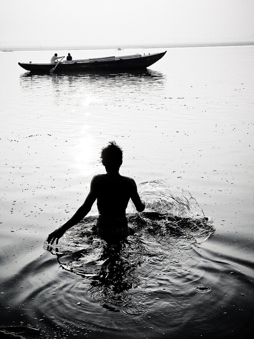 Pilgrims bathing at ghat steps on river Ganges Gats in Varanasi banaras Uttar Pradesh India