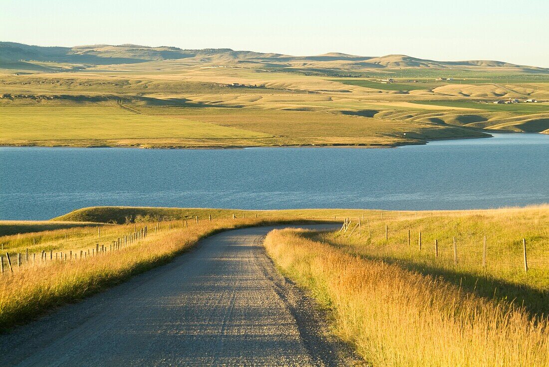 road leading to the lake formed by the Old Man River dam north of Pincher Creek, Alberta, Canada