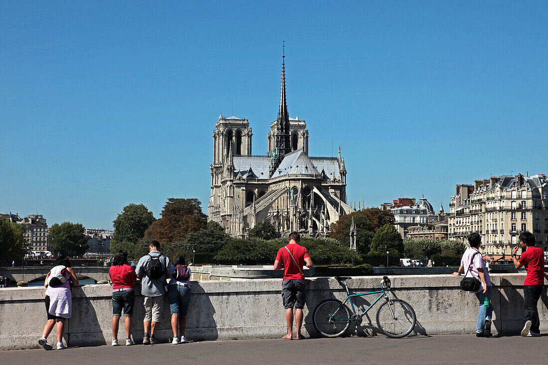 Tourists Admiring Notre Dame Cathedral From The La Tournelle Bridge, 4Th Arrondissement, Paris, France