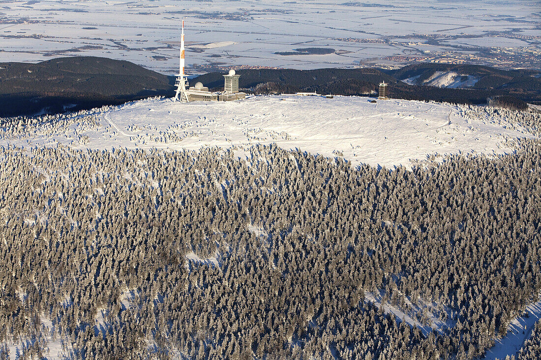 Aerial view above the snow covered Brocken mountain in Harz National Park, Transmitter site, Saxony-Anhalt, Germany