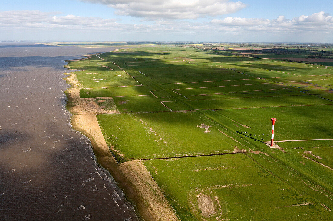 Aerial shot of lighthouse in Elbe Marshes, Elbe River, Otterndorf, Lower Saxony, Germany