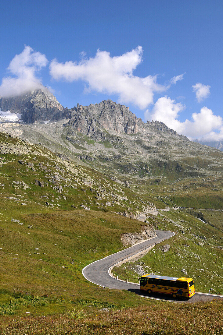 Bus passing Furka Pass, Uri, Switzerland