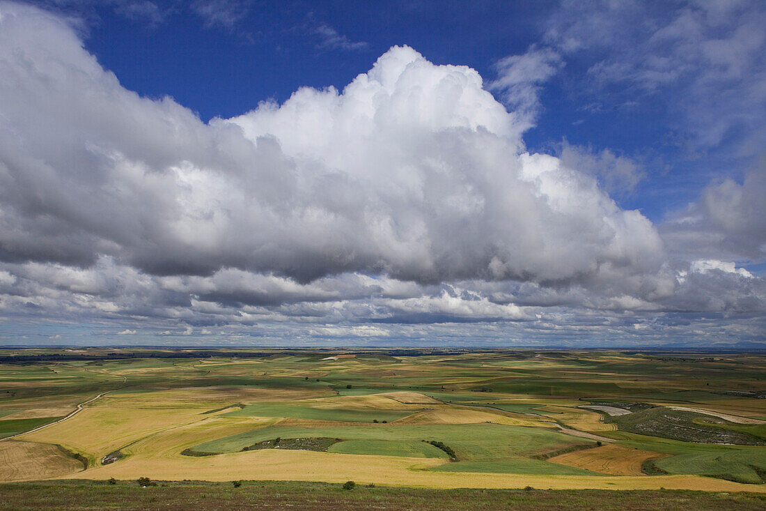 View from the hilltop Alto de Mostelares at plain under clouded sky, province of Burgos, Old Castile, Castile-Leon, Castilla y Leon, Northern Spain, Spain, Europe