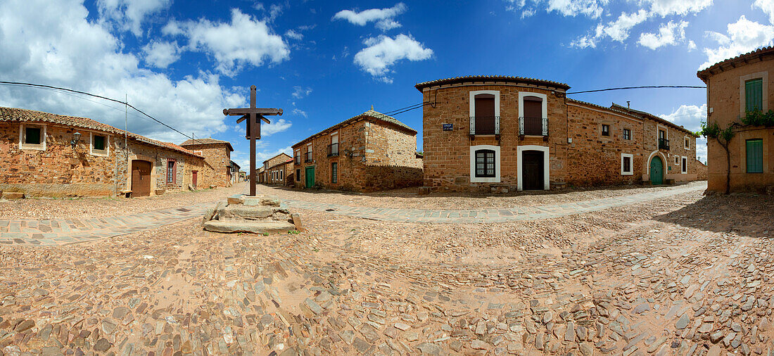 Houses and cross at the village of Castrillo de los Polvazares, Province of Leon, Old Castile, Castile-Leon, Castilla y Leon, Northern Spain, Spain, Europe