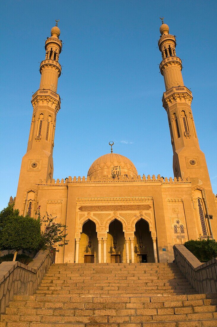 The Tabia Grand Mosque in Aswan Egypt lit up at sunset