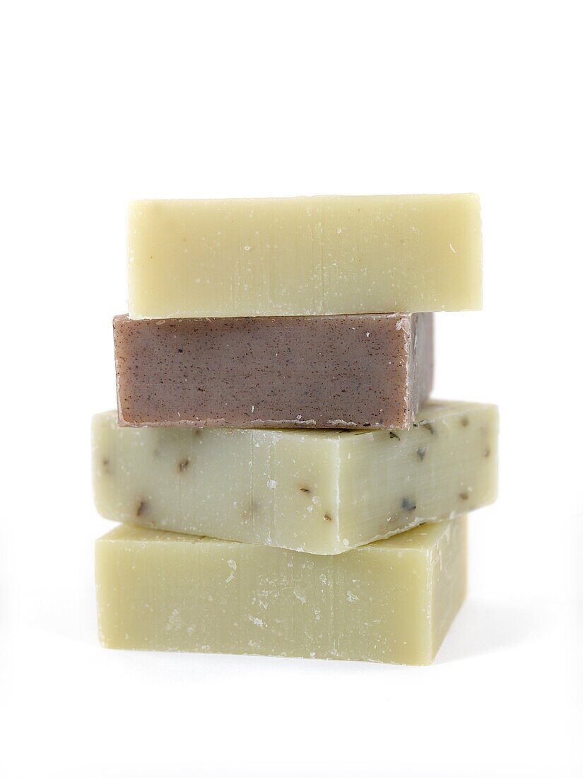 Scented olive oil soaps isolated against a white background