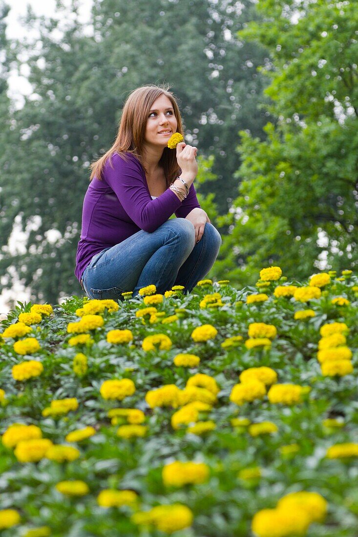 Young woman in flowers