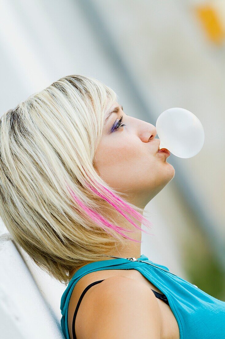 Blowing a bubble gum