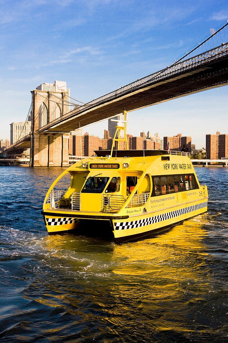 ferry under Brooklyn Bridge, Manhattan, New York City, USA