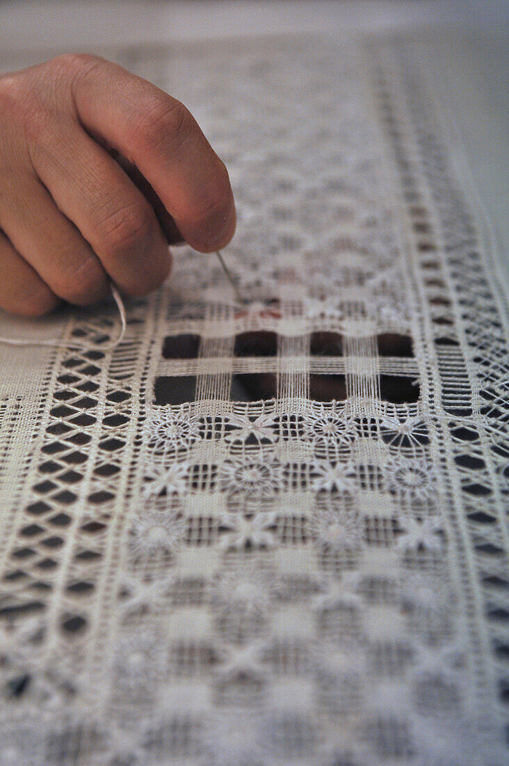 working on a piece of embroidery in the Casa de las Balcones, La Orotava, Tenerife, Canary Islands, Spain