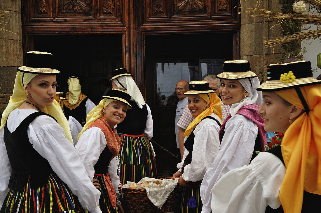Group of women in canrian traditional costume in front of the church portal at Los Realejos, Romeria, Tenerife, Canary Islands, Spain, Romeria