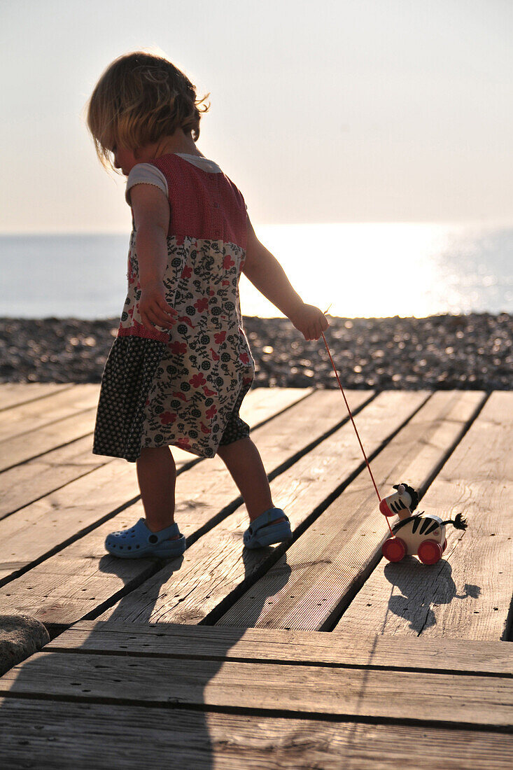 Little Girl Playing On The Boardwalk, Somme (80), Picardy, France