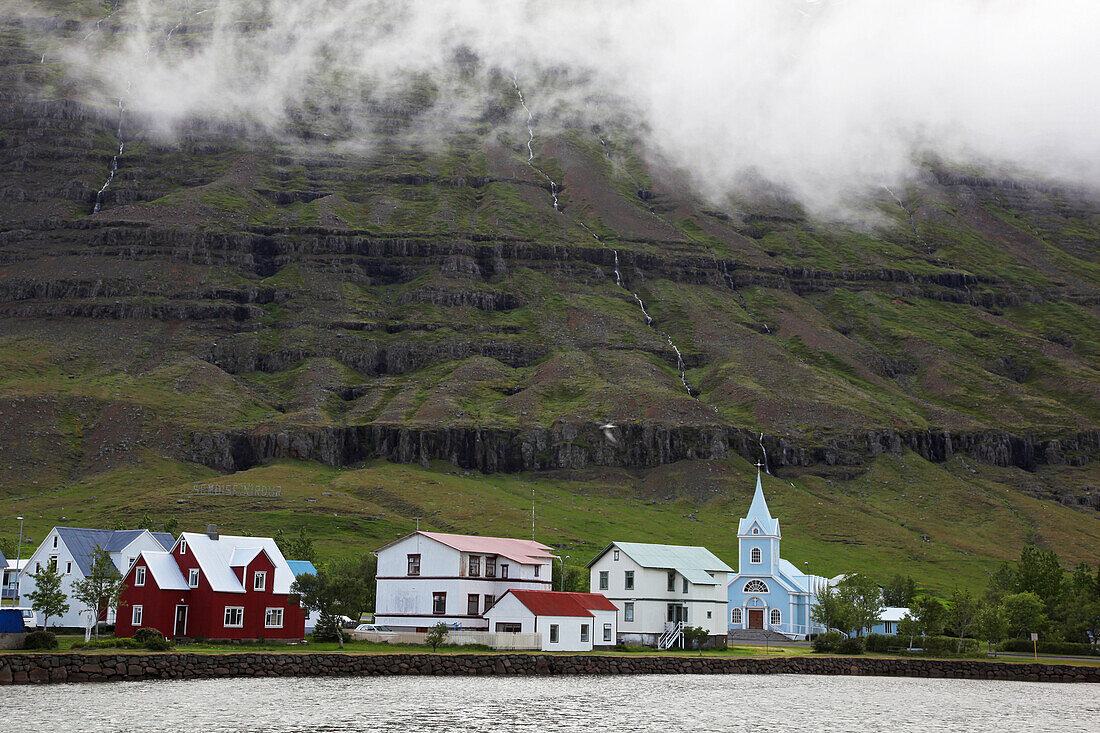 Seydisfordur, Houses And Church By The Waterside Region Of The Fjords In Northeast Iceland, Europe, Iceland
