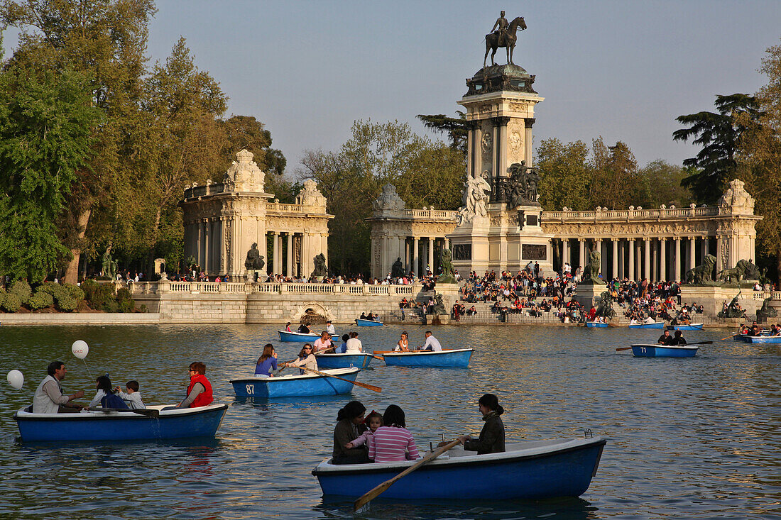 Lake With Small Boats In Front Of The Monument In Homage To Alphonse Xii, Parque Del Buen Retiro, Madrid, Spain