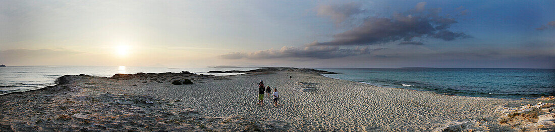 Family on beach playa llevant at sunset, Ibiza, Balearic Islands, Spain