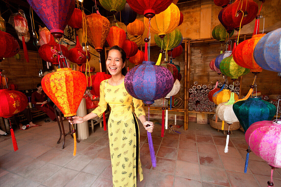 Woman inside a lampion store, Hoi An, Annma, Vietnam