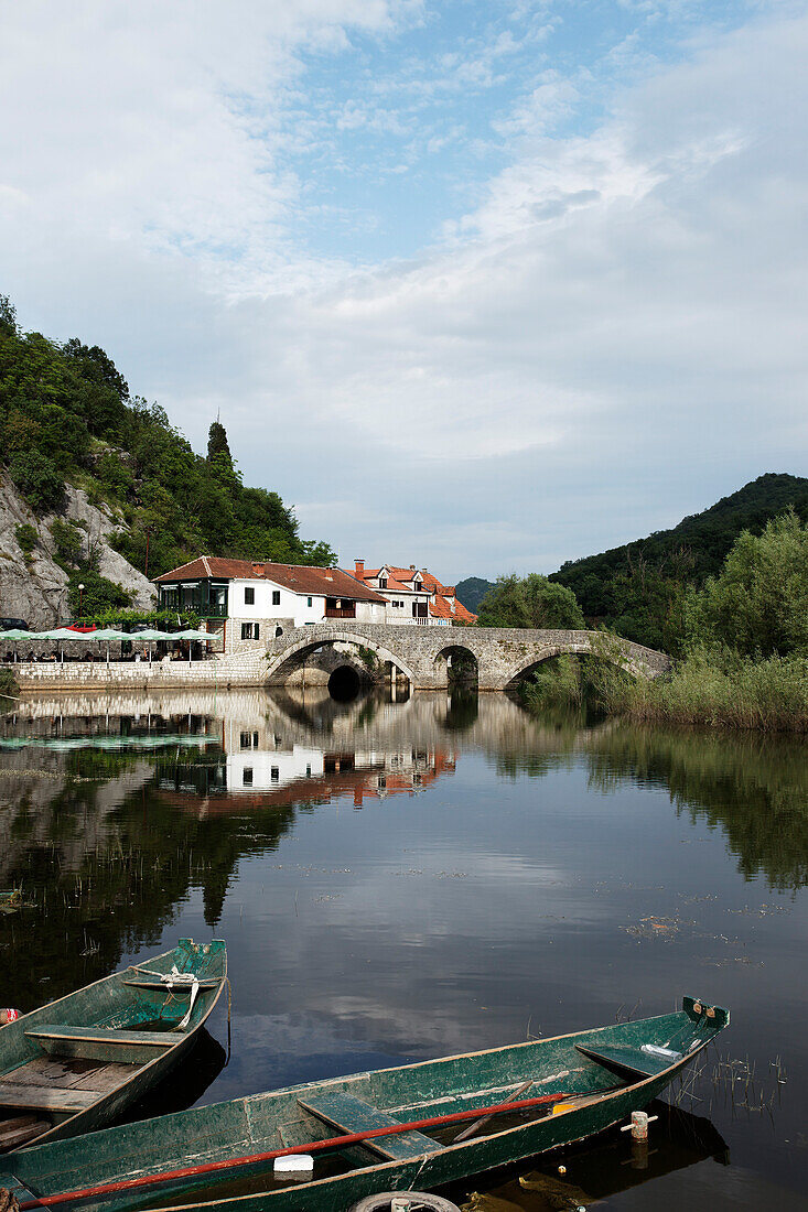 Restaurant and stone bridge at the river Rijeka Crnojevica, River to Lake Skadar, Montenegro, Europe