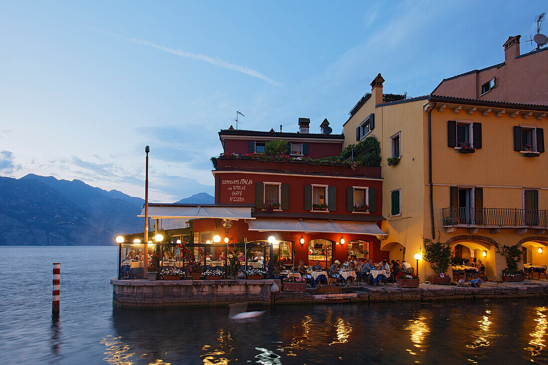 Restaurant, illuminated, Malcesine, Lake Garda, Veneto, Italy