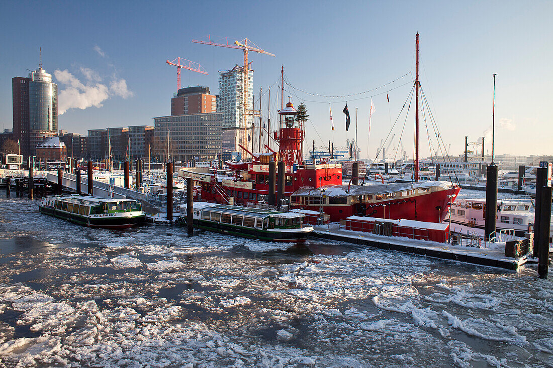 Fire ship in front of HTC Hanseatic Trade Center and Elbphilharmonie in winter, the Free and Hanseatic City of Hamburg, Germany, Europe