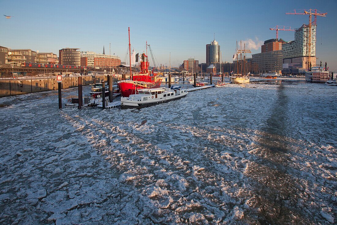 Fire ship in front of HTC Hanseatic Trade Center and Elbphilharmonie in winter, the Free and Hanseatic City of Hamburg, Germany, Europe