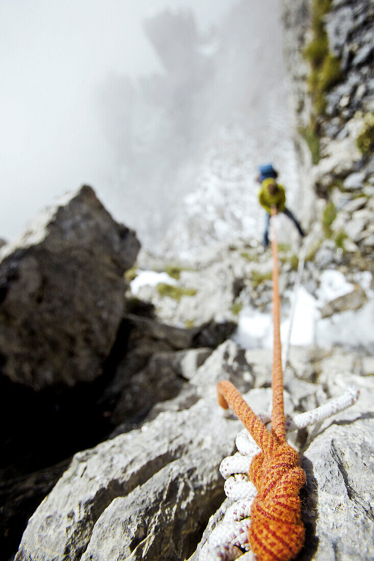 Climber abseiling, Schilthorn, Bernese Oberland, Canton of Bern, Switzerland