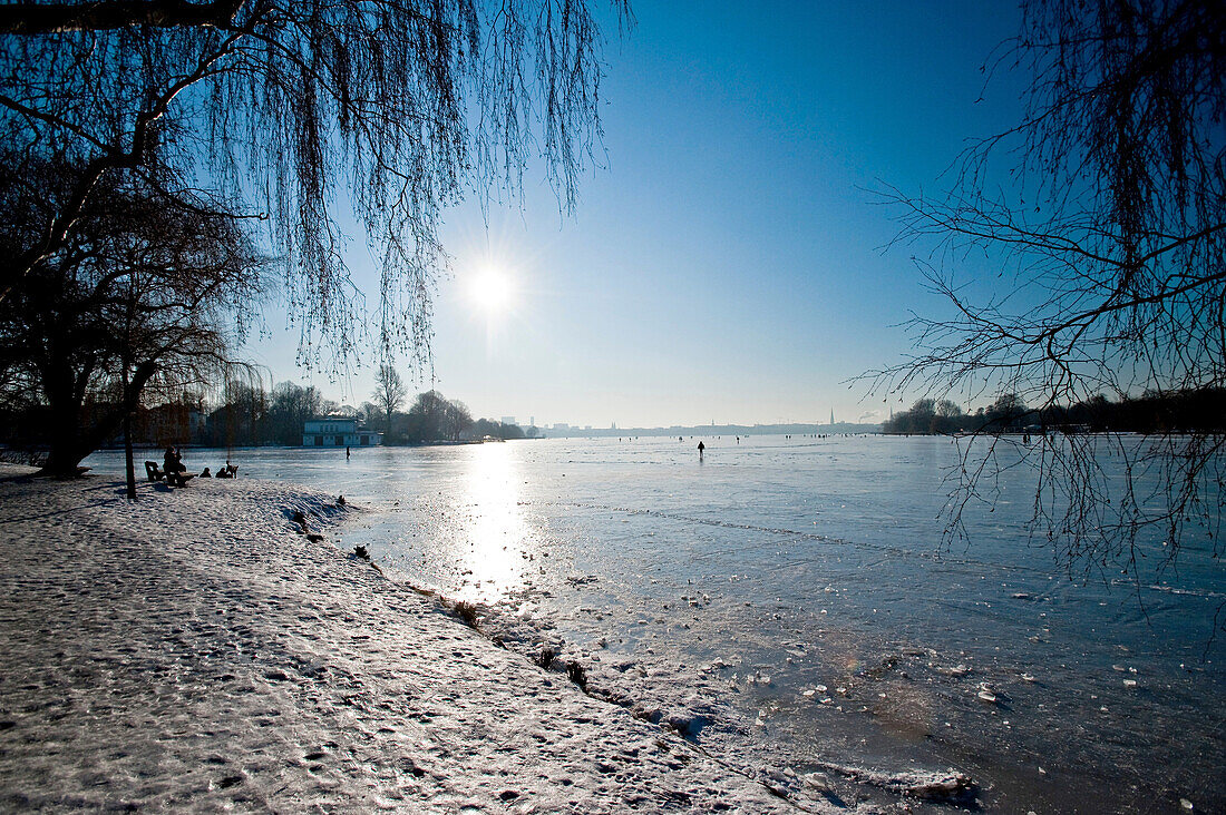 Snowy riverbank at frozen Aussenalster, winter impressions, Hamburg, Germany, Europe