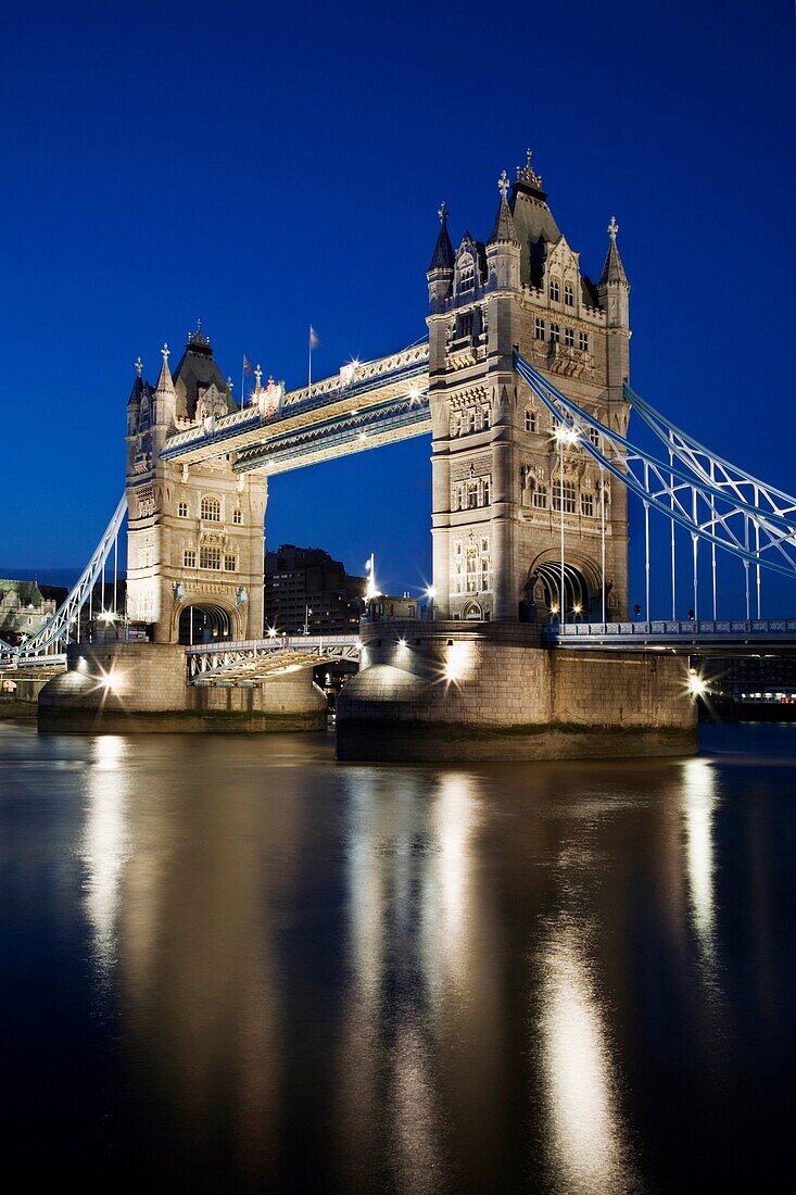 Reflections of the Floodlit Tower Bridge in the River Thames at Dusk London England