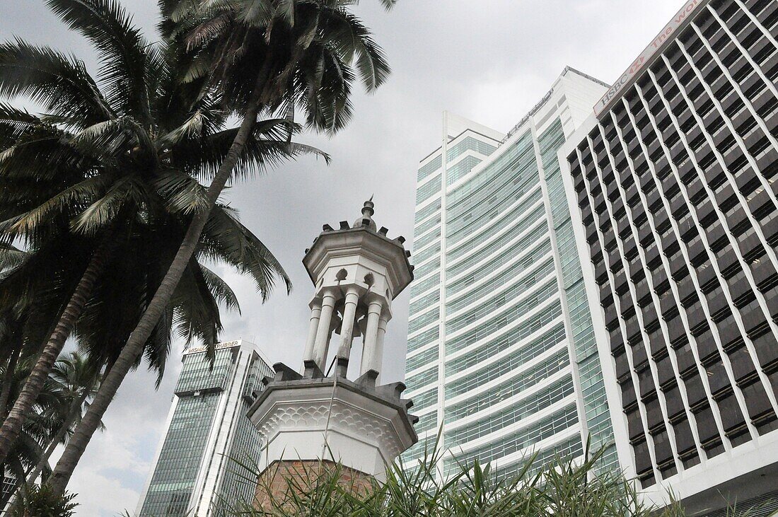 Kuala Lumpur (Malaysia): the Masjid Jamek Mosque's minaret and skyscrapers in the KL's historical center