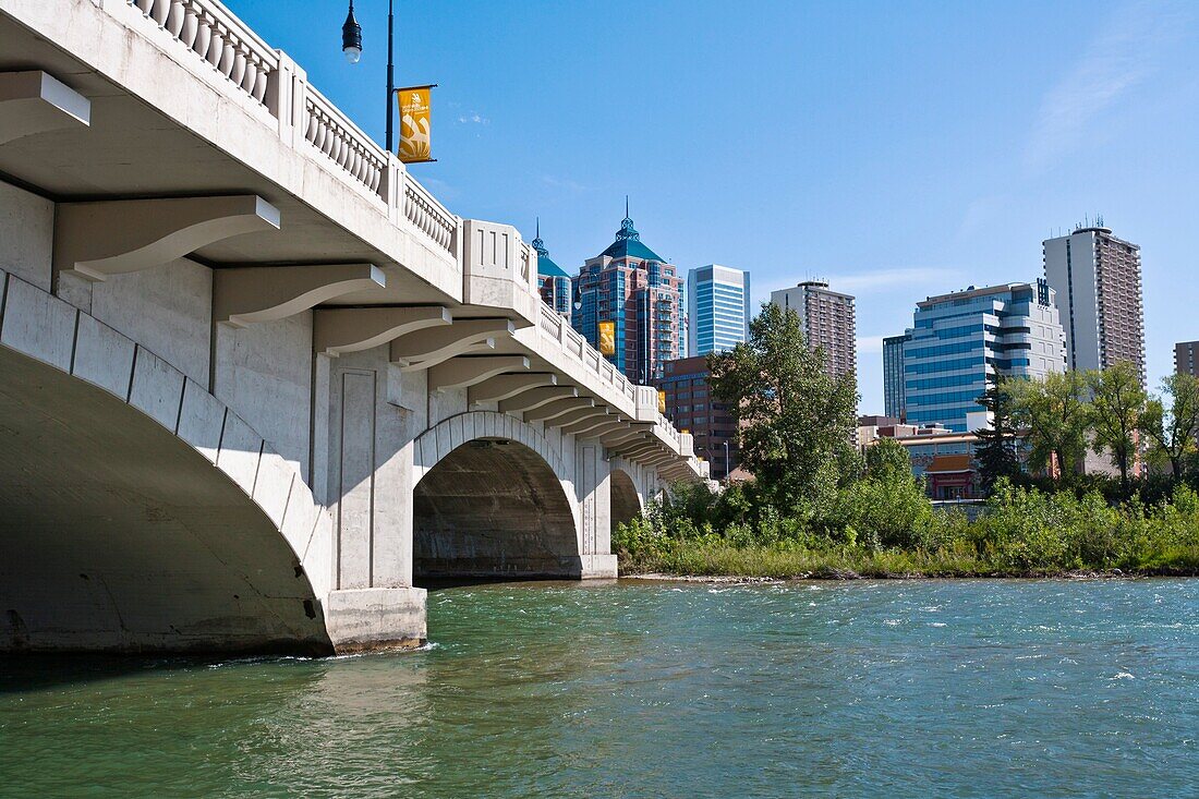 Bow River with bridge Louise and the skyline of Calgary in Alberta, Canada