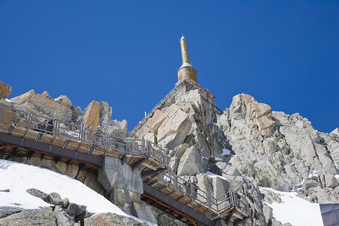 Lower terrace and summit tower at the top of the Aiguille Du Midi. Chamonix. Mont Blanc Massif. France.