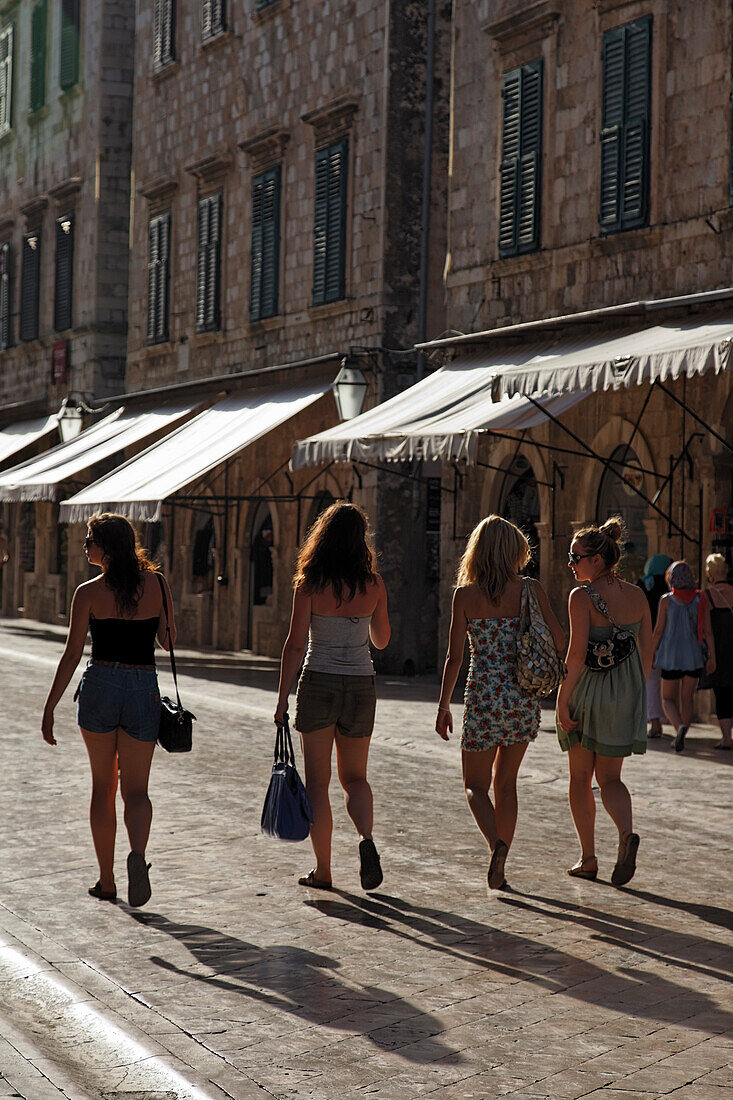 Young women strolling along Stradun, Dubrovnik, Dubrovnik-Neretva county, Dalmatia, Croatia